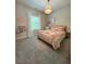 Light and airy bedroom with a charming chandelier, window, and decor at 4736 Landing Water Path, Buford, GA 30519