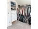Walk-in closet with ample hanging storage and shelving for clothes and accessories at 4736 Landing Water Path, Buford, GA 30519