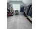Spacious closet featuring ample storage and light grey carpeting with a window for natural light at 4736 Landing Water Path, Buford, GA 30519