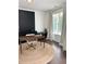 Bright home office with built-in shelves, a comfortable desk, and lots of natural light at 4736 Landing Water Path, Buford, GA 30519