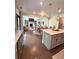 View of kitchen, dining, and living space offering an ideal layout for entertaining at 4736 Landing Water Path, Buford, GA 30519