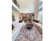 Bright, open-concept living room with dark wood floors, leading into the kitchen and dining area at 4736 Landing Water Path, Buford, GA 30519