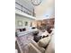 Living room showcases an open layout with a view of the dining area and kitchen at 4736 Landing Water Path, Buford, GA 30519