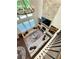 Second floor view of living room with stone fireplace, built-in shelves, and plenty of natural light at 4736 Landing Water Path, Buford, GA 30519