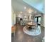 Open-concept living space showcasing hardwood floors, modern lighting, and stainless steel appliances at 4736 Landing Water Path, Buford, GA 30519