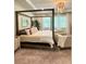A spacious main bedroom features a decorative chandelier, sitting area, and a four-poster bed at 4736 Landing Water Path, Buford, GA 30519