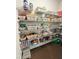 Organized walk-in pantry features wire shelving holding various canned goods and snacks at 4736 Landing Water Path, Buford, GA 30519