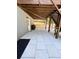 Underneath a deck, a stone patio with a modern outdoor kitchen and grill provides an ideal entertaining space at 4736 Landing Water Path, Buford, GA 30519