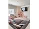 Well-lit playroom with a large couch and dollhouses at 4736 Landing Water Path, Buford, GA 30519