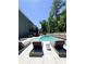 Relaxing backyard with large in-ground pool, lounge chairs, and a patio for outdoor enjoyment at 4736 Landing Water Path, Buford, GA 30519