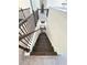 Staircase with dark wood steps and black iron railing at 4736 Landing Water Path, Buford, GA 30519
