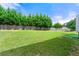 Large, green backyard with a privacy fence and well-maintained lawn at 1892 Ivy View Walk, Loganville, GA 30052