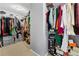 This walk-in closet is fully stocked with clothes, shoes, and accessories at 1892 Ivy View Walk, Loganville, GA 30052
