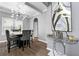 Modern dining room with a stylish chandelier, coffered ceiling, and sophisticated decor at 1892 Ivy View Walk, Loganville, GA 30052