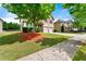 Beautifully landscaped front yard with a well-maintained lawn and a welcoming facade at 1892 Ivy View Walk, Loganville, GA 30052