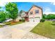 Charming home with a two-car garage, well-kept lawn, and attractive curb appeal at 1892 Ivy View Walk, Loganville, GA 30052