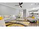 Bright living room features modern decor, hardwood floors, and plush seating, perfect for entertaining guests at 1892 Ivy View Walk, Loganville, GA 30052