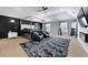 Spacious main bedroom featuring modern design with a seating area, fireplace, and large windows at 1892 Ivy View Walk, Loganville, GA 30052