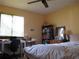 Cozy bedroom with a window view, desk space, and ample storage at 2494 Bronco Trl, Duluth, GA 30096