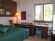 Bedroom with a desk area and natural light from the window at 2494 Bronco Trl, Duluth, GA 30096