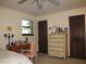 Spacious bedroom featuring neutral walls, a cozy desk and comfortable dresser at 2494 Bronco Trl, Duluth, GA 30096
