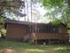Exterior view of a brown home with a screened porch at 2494 Bronco Trl, Duluth, GA 30096