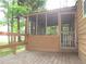 Home's exterior featuring a screened-in porch area and wooden deck at 2494 Bronco Trl, Duluth, GA 30096
