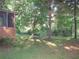 View of a house's backyard featuring a screened-in porch at 2494 Bronco Trl, Duluth, GA 30096