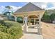 Community pavilion with picnic tables, seating, grill and manicured landscaping around the space at 55 Little Barley Nw Ln, Grayson, GA 30017