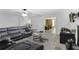 Open-concept living room with views to other living spaces, neutral paint, and modern lighting at 1105 Mitchell Crossing Sw Dr, Atlanta, GA 30331