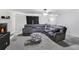 Spacious living room offering a fireplace, ceiling fan, and comfortable seating arrangement at 1105 Mitchell Crossing Sw Dr, Atlanta, GA 30331