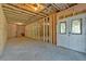 Unfinished basement featuring framed walls, double-door access, and concrete foundation at 33 Cedar Gate Ln, Kingston, GA 30145