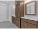 Bright bathroom boasting dark wood cabinets, double sinks and a framed mirror at 33 Cedar Gate Ln, Kingston, GA 30145
