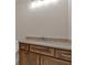 Bathroom vanity featuring a sink with granite countertop and wooden cabinets with drawers at 33 Cedar Gate Ln, Kingston, GA 30145