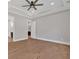 Primary bedroom featuring a tray ceiling, neutral walls, and wood floors leading to the en suite at 33 Cedar Gate Ln, Kingston, GA 30145