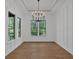 Bright dining area with wainscoting, tray ceiling, and lots of natural light from windows at 33 Cedar Gate Ln, Kingston, GA 30145