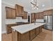 A modern kitchen with stainless steel appliances and a center island with a sink at 33 Cedar Gate Ln, Kingston, GA 30145