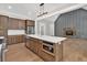 Modern kitchen with stainless steel appliances, white countertops, dark wood cabinets, and a central island at 33 Cedar Gate Ln, Kingston, GA 30145