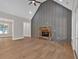 Open-concept living room featuring a vaulted ceiling, stone fireplace, and seamless transition to other living spaces at 33 Cedar Gate Ln, Kingston, GA 30145