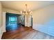 Charming dining room features modern floors and elegant chandelier lighting at 655 Wellingborough Ct, Alpharetta, GA 30005