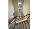 Bright foyer showcasing a staircase, wood floors, and a stylish chandelier at 655 Wellingborough Ct, Alpharetta, GA 30005