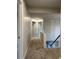 Upstairs hallway with carpeted floor and view of the staircase at 655 Wellingborough Ct, Alpharetta, GA 30005