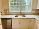 Bright kitchen area showcasing stainless steel sink and window at 655 Wellingborough Ct, Alpharetta, GA 30005