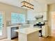 Modern kitchen features stainless steel appliances and an island at 655 Wellingborough Ct, Alpharetta, GA 30005