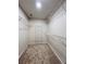 Spacious walk-in closet with shelving and carpeted floors, perfect for organizing your wardrobe at 655 Wellingborough Ct, Alpharetta, GA 30005