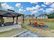 Enjoy outdoor living with a gazebo, paved patio, and fire pit with seating in this spacious backyard at 1603 Maston Rd, Auburn, GA 30011
