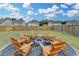 The fenced backyard features a fire pit and seating, creating an inviting space for relaxation and entertainment at 1603 Maston Rd, Auburn, GA 30011