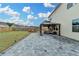 Expansive backyard with a patio, gazebo, firepit area, and lush green lawn at 1603 Maston Rd, Auburn, GA 30011