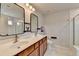 Bathroom with double sink vanity and a tub with shower at 1603 Maston Rd, Auburn, GA 30011