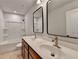 Bathroom with double sink vanity and a tub with shower at 1603 Maston Rd, Auburn, GA 30011